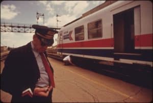 Conductor Checks his Time for Train