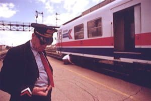 Conductor-Checks-his-Time-for-Train Late Delayed